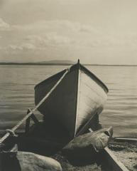 Bow of a small boat on the shore, circa 1940